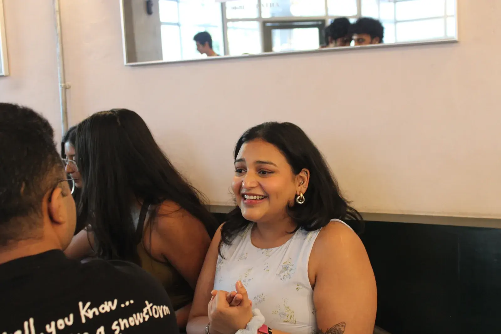 A guest laughing during an NPC board game meetup